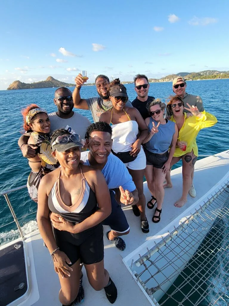 A group of travelers enjoying time together aboard a catamaran