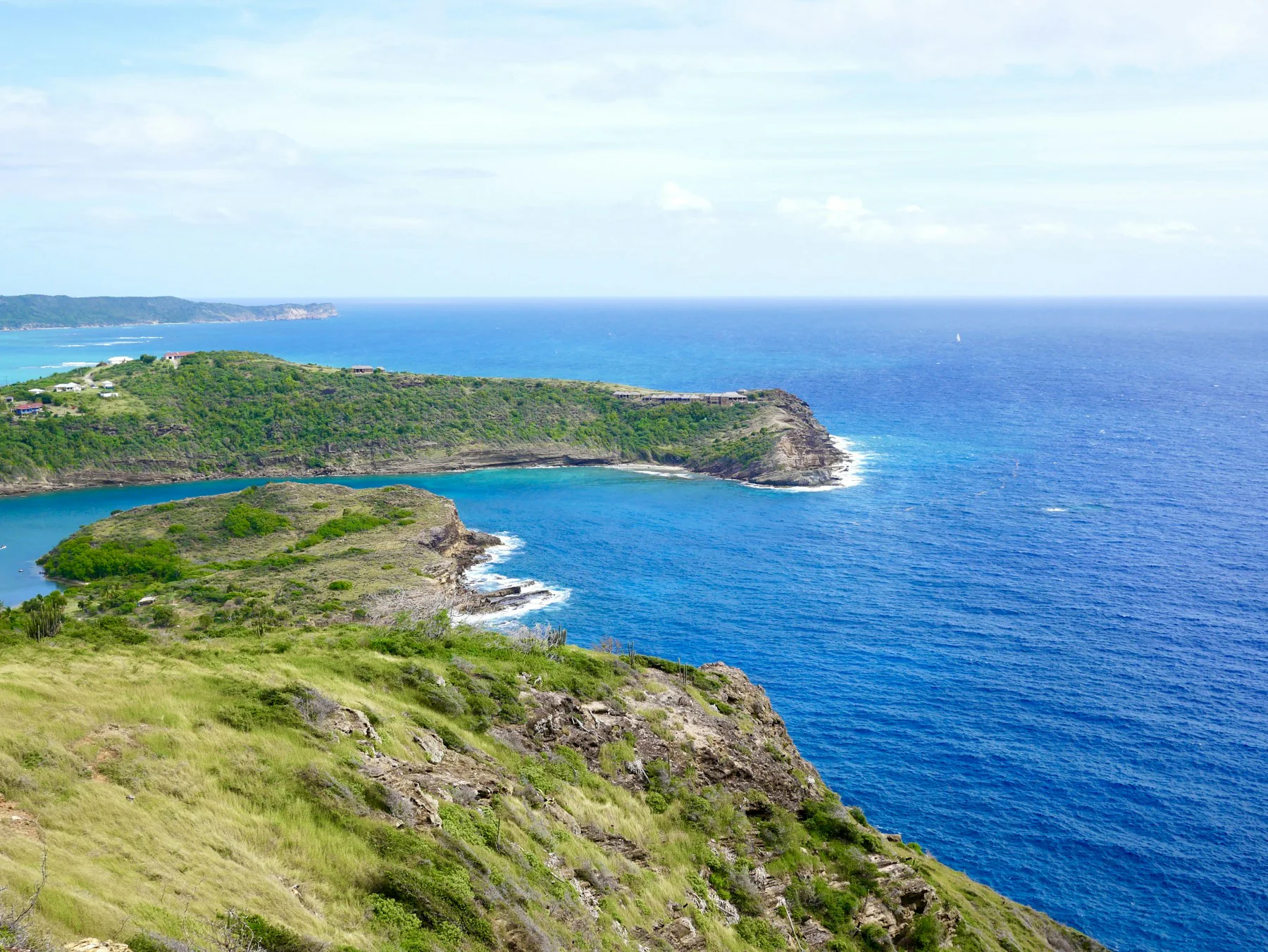 Rocky Antigua shoreline beneath a blue sky