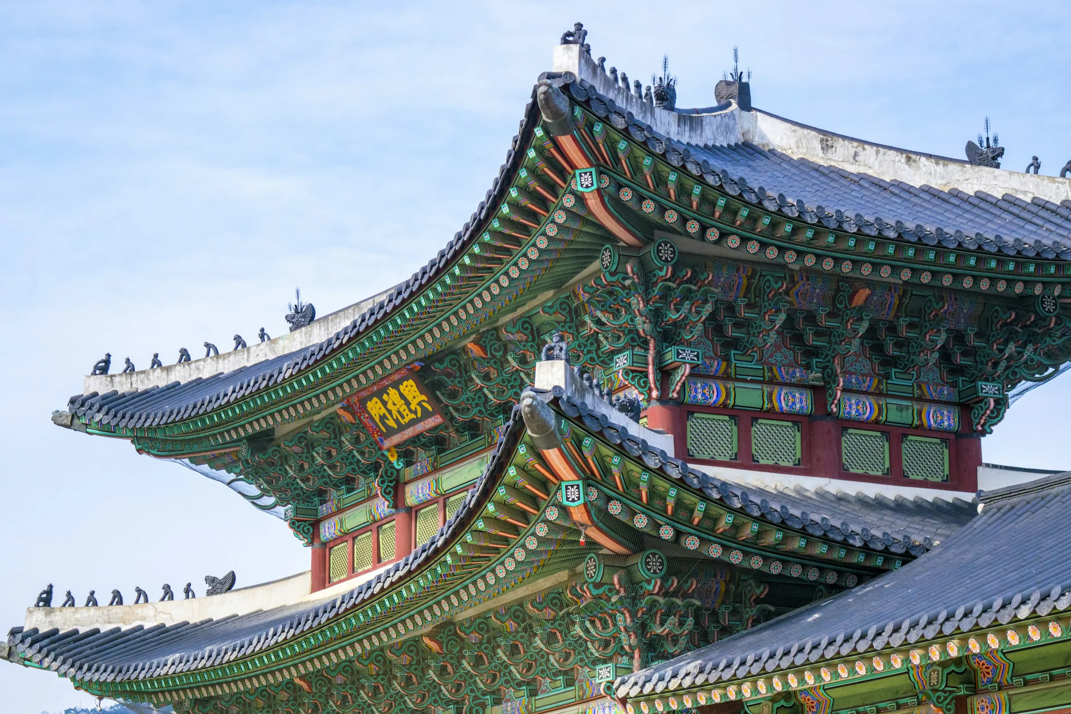 Traditional Korean temple surrounded by mountain scenery